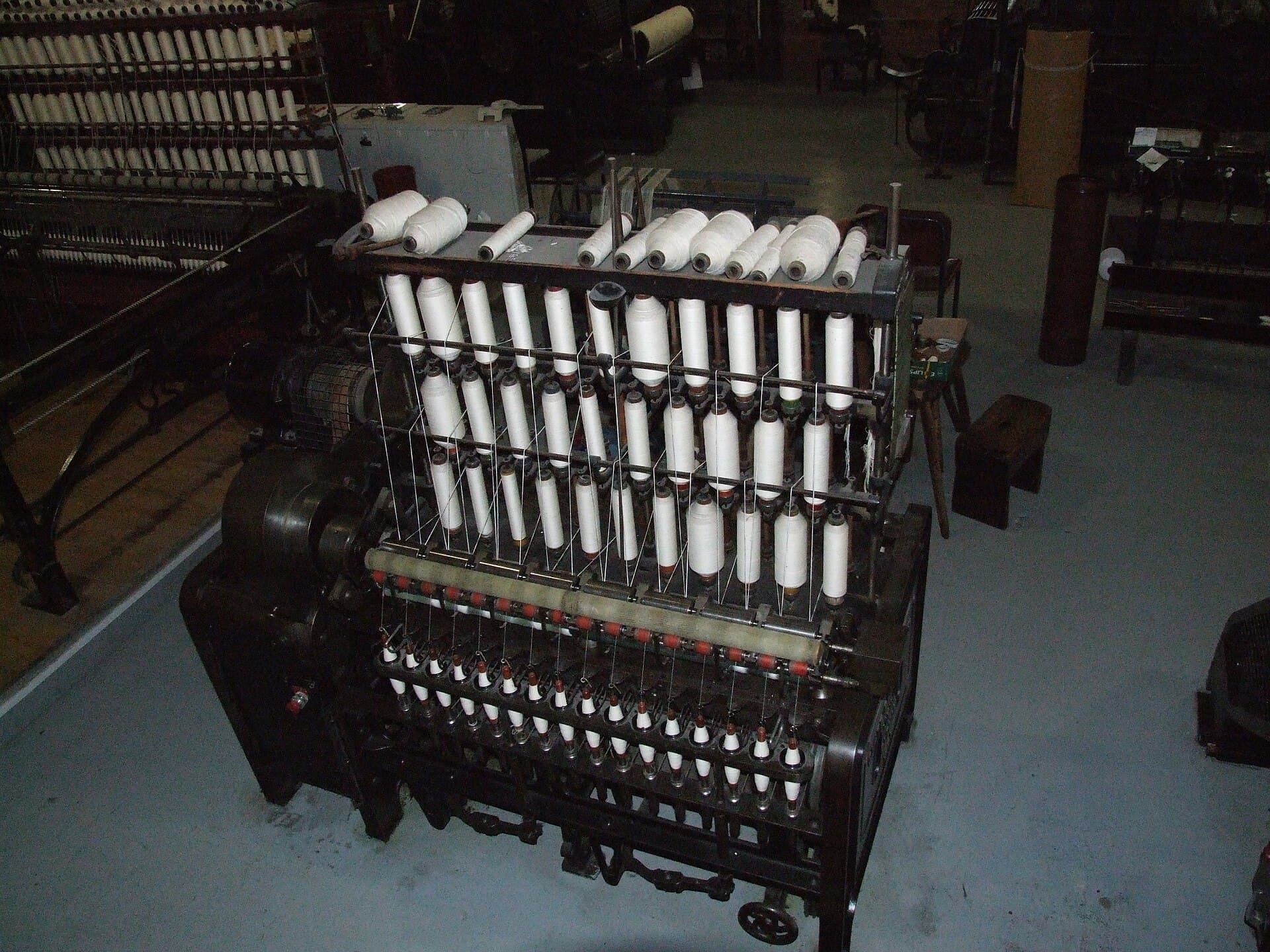 Spinning frames converting cottonized pineapple fiber staple into fine-count yarn